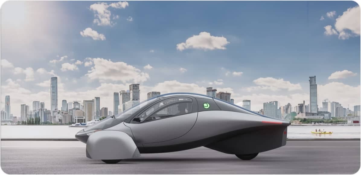 Aptera solar electric vehicle in front of a city skyline