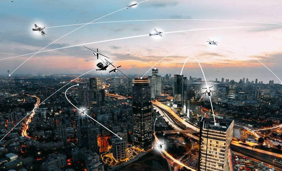 Graphic showing several eVTOl aircraft flying over a busy city