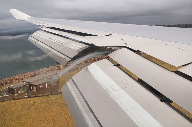 Close up shot of contrails on a high lift airplane wing configuration in the air