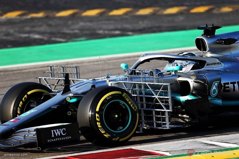 A Formula One car on the track with sensors mounted
